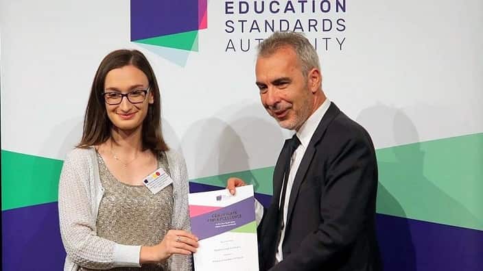 Student Athanasia-Ellada Vardaki-Vertzagia with Tom Alegounarias, Chair of the NSW Education Standards Authority. 