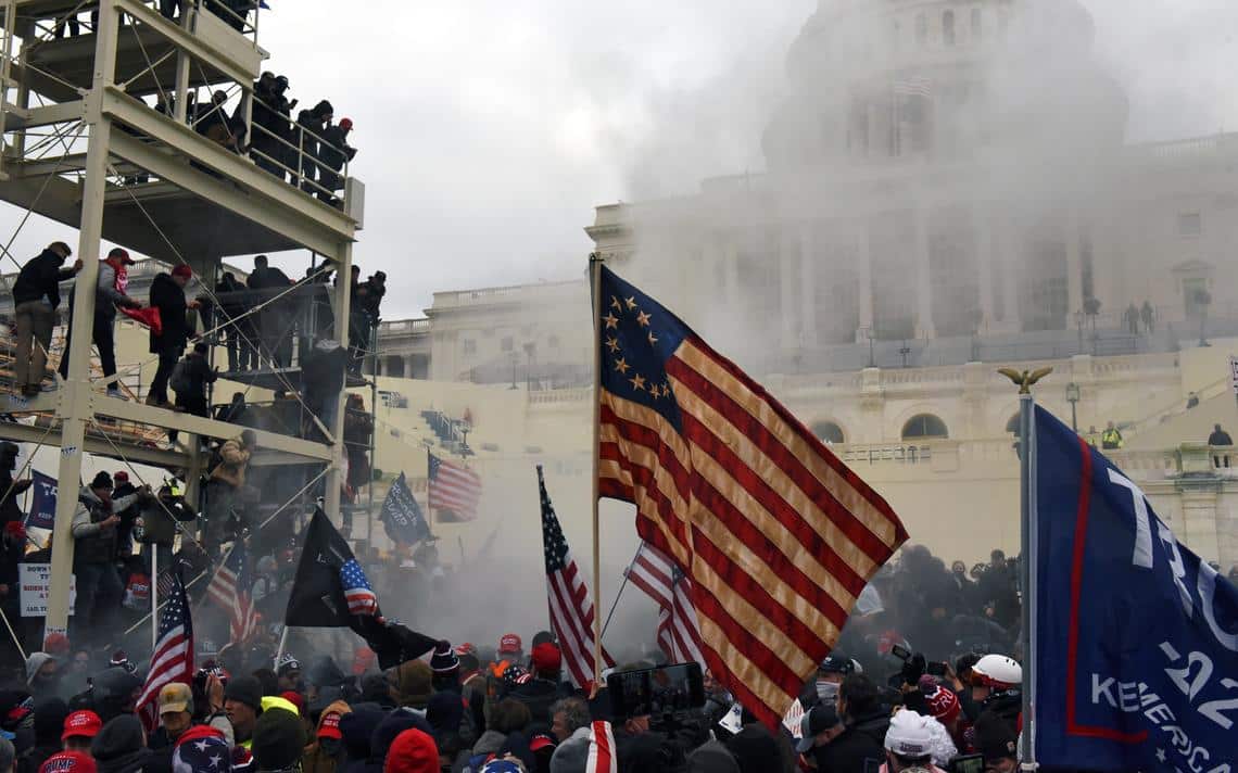 Smoke billows in front of the U.S. Capitol Building in Washington, Jan. 6, after a mob stormed the building 