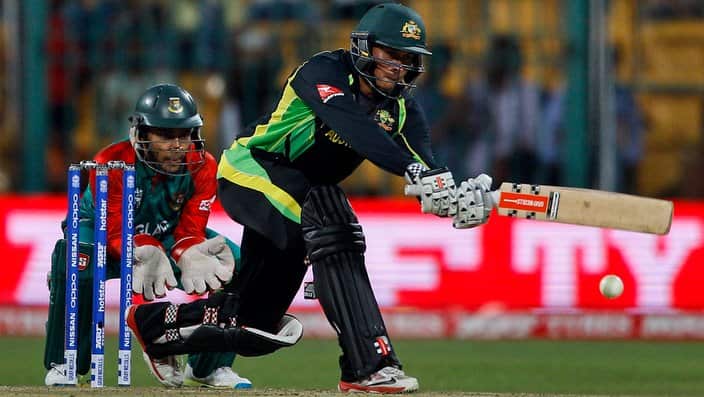 Bangladesh's wicketkeeper Mushfiqur Rahim, left, watches Australia's Usman Khawaja play a shot during their ICC World Twenty20 2016 cricket match in Bangalore, India, Monday, March 21, 2016