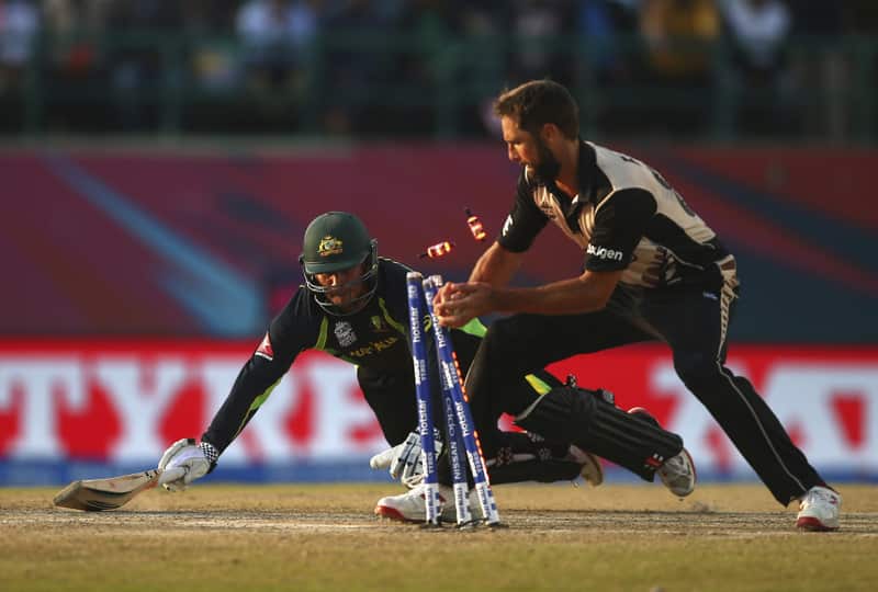 Usman Khawaja of Australia is run out by Grant Elliott 