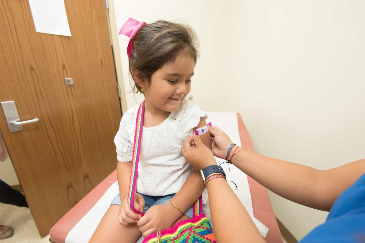 A girl having a vaccination