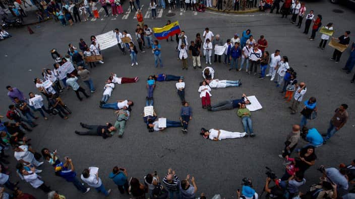Doctors, nurses and public hospital staff protest to demand better wages, medicines and medical supplies in Caracas, Venezuela, 02 August 2018.