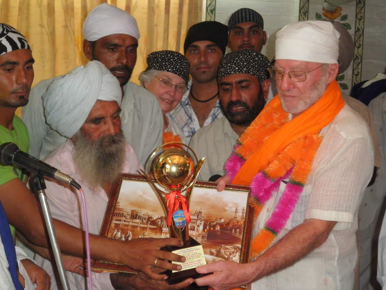 The group from Australia received gifts from the village. Len Kenna is seen here receiving his