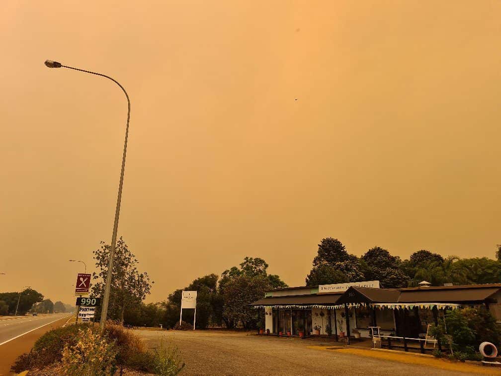the farm is covered with smoke from the bushfire