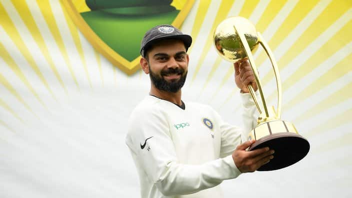 Indian captain Virat Kohli lifts the Border-Gavaskar Trophy