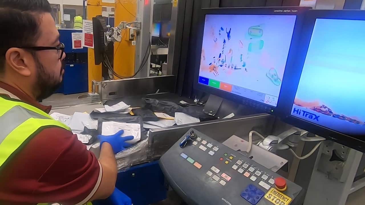 Officer inspecting mails arriving in Australia