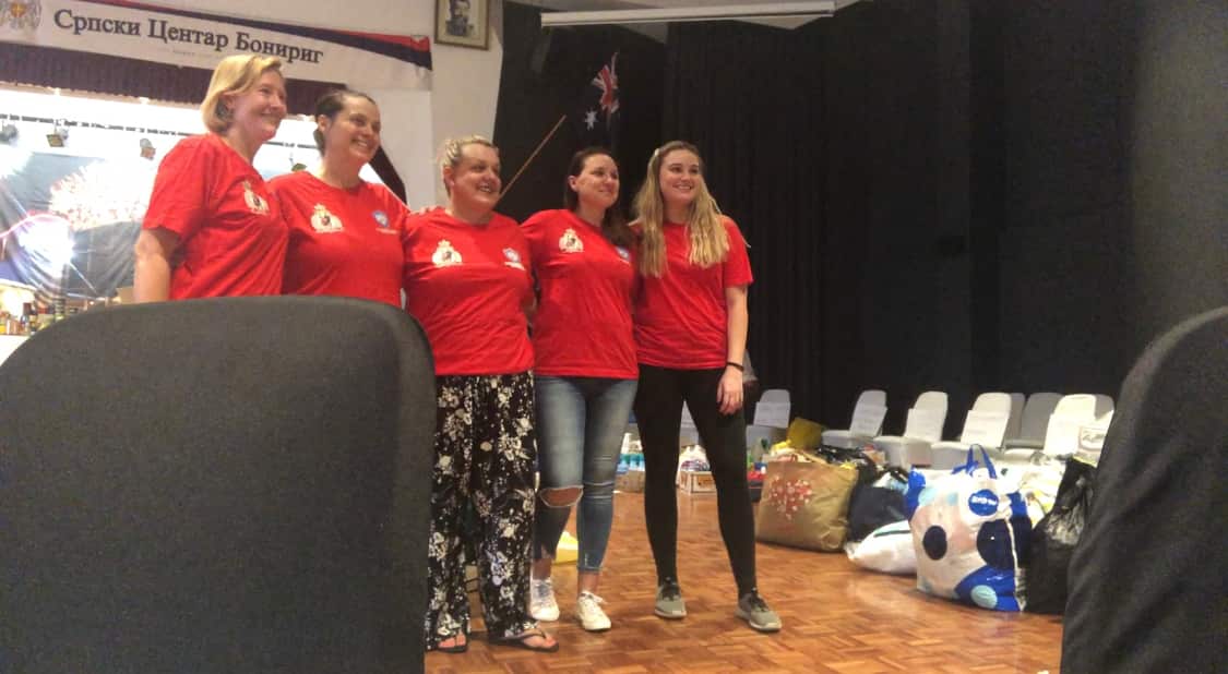 A group photo after a long day of packing 