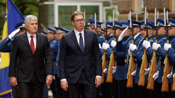 Serbia's President Aleksandar Vucic, second left, poses for photos with members of the Bosnian Tripartite Presidency, from left, Bakir Izetbegovic, Dragan Covic, and Mladen Ivanic, during a welcoming ceremony at the Bosnian Presidency in Sarajevo