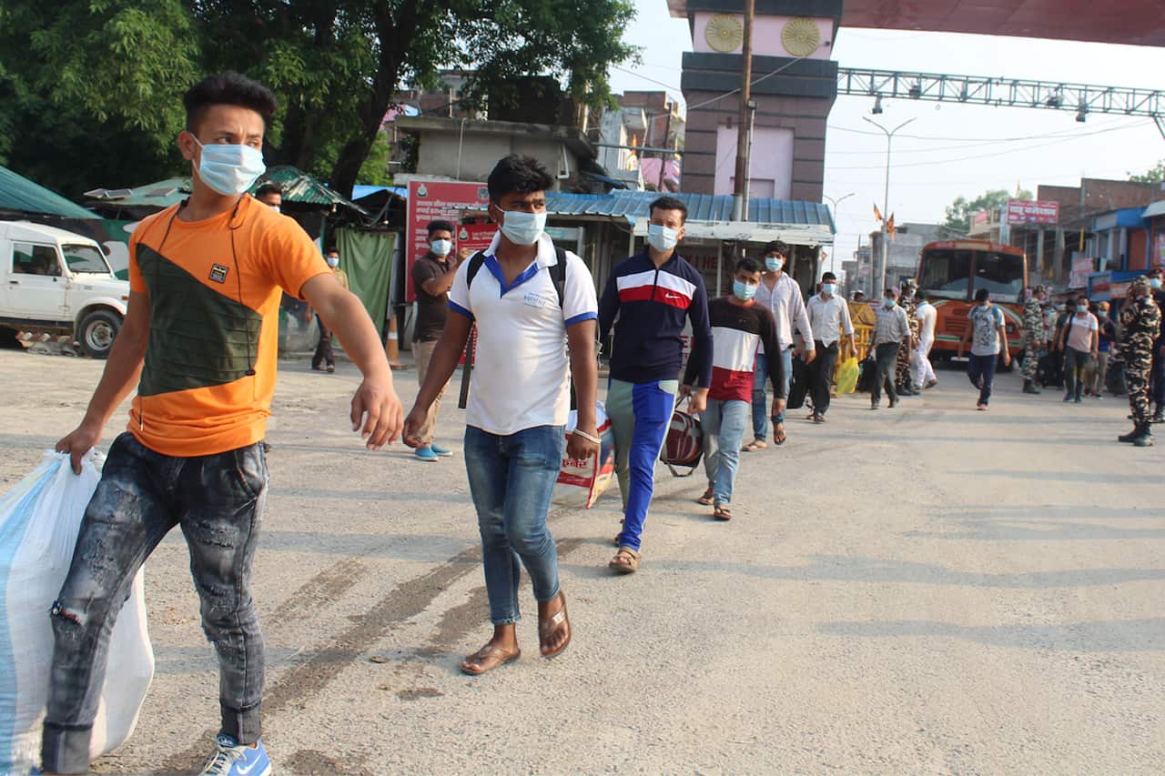 Stranded workers walking back home in Lumbini, Nepal after coronavirus lockdown.