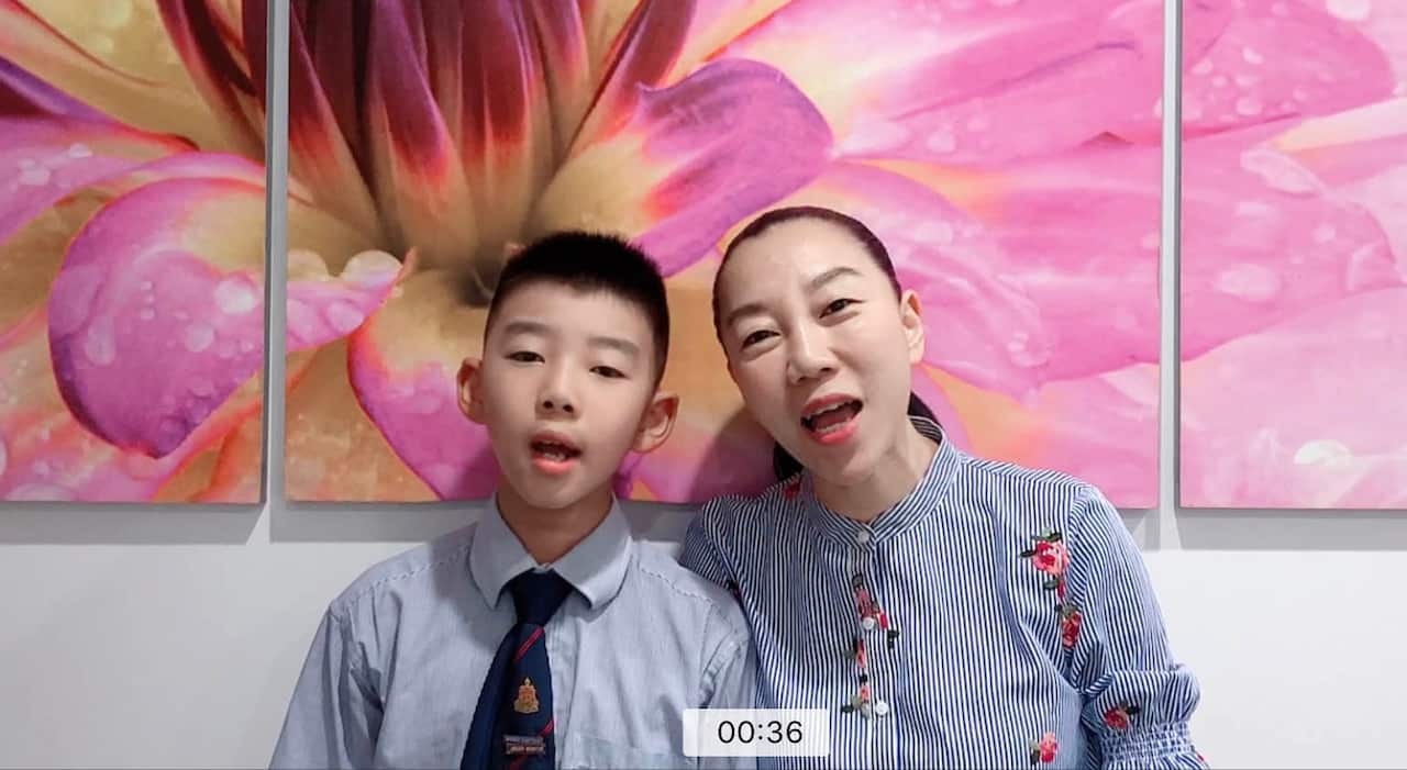 Sarah Ruan and her son singing together