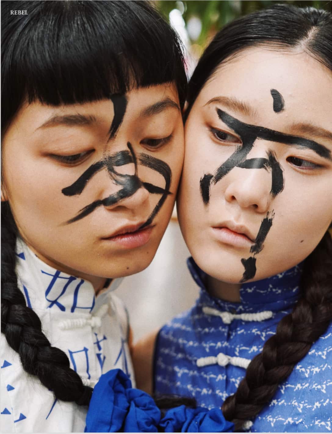 Wenmiao Xin's fashion photography expressed the suppressed environment Chinese women were facing by writing two Chinese characters on models' faces.