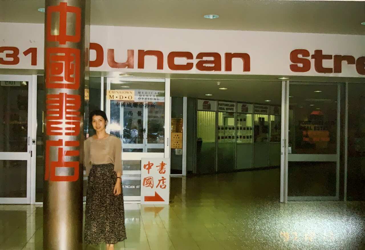 Australia China Book Shop co-founder Wendy Liu in front of store.