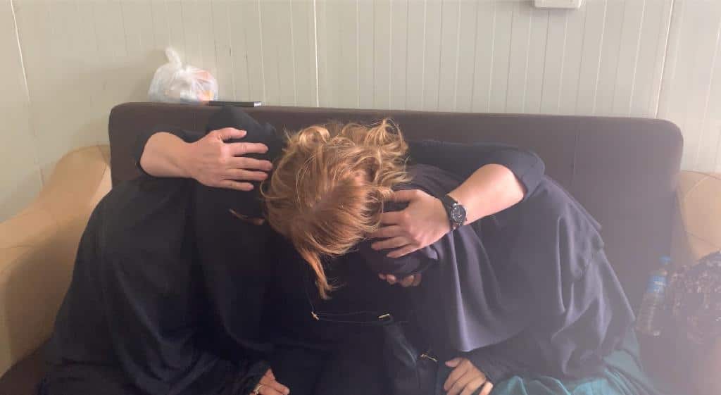 Sonua Abbas embracing her sister and neice in Al-Hol camp