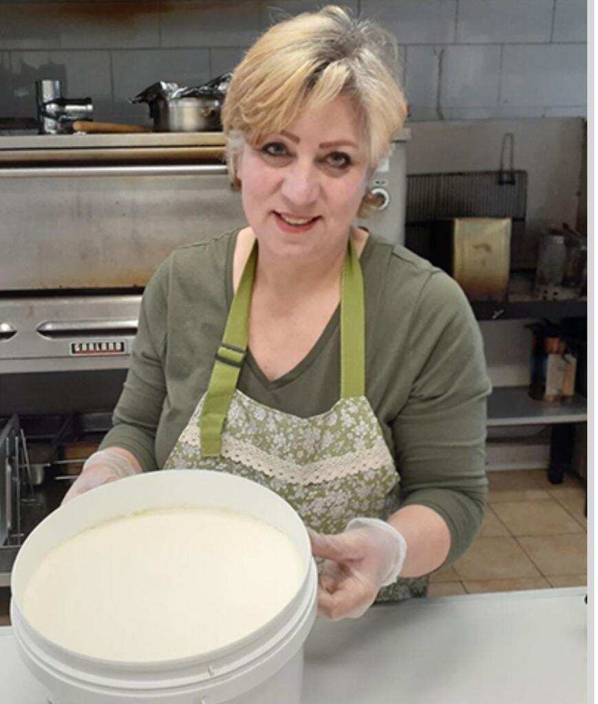 Mrs Abou in the "Shamiat" kitchen at Northcot, North Melbourne.