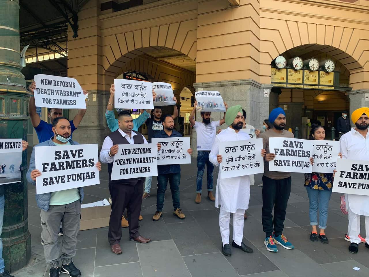 A group of protesters at Flinders Street Station, Melbourne.