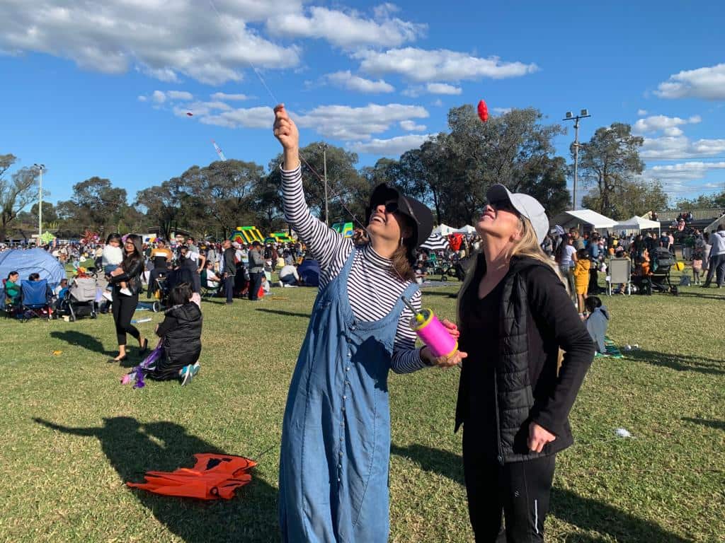 Dharmista and Lizz enjoying kite flying