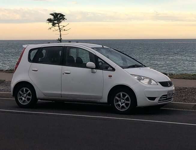 Nishal Ghimire’s white Mitsubishi Colt 