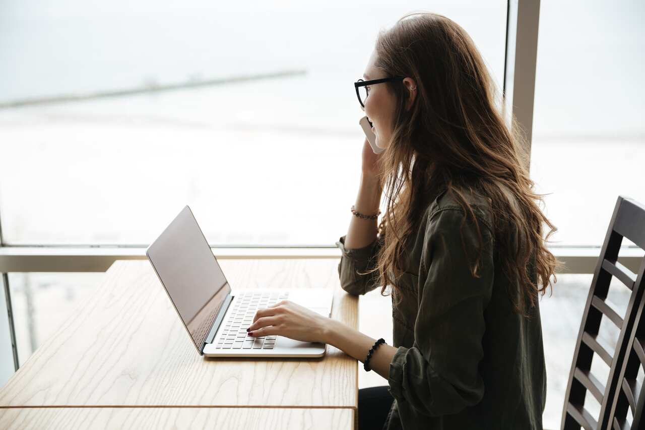 Woman in cafe using laptop