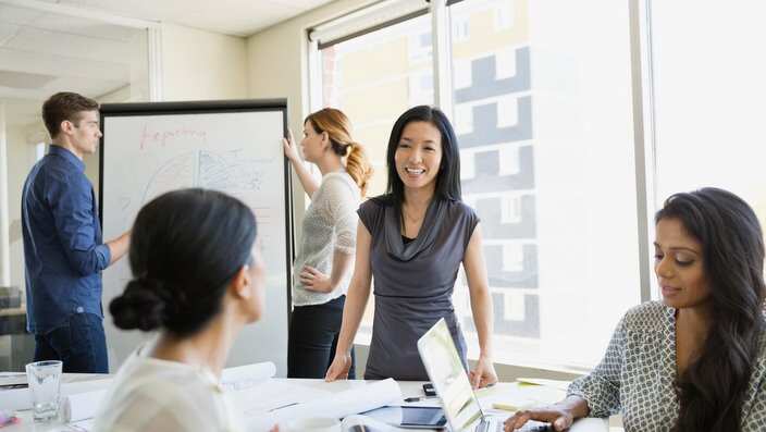 Business colleagues working on project in office