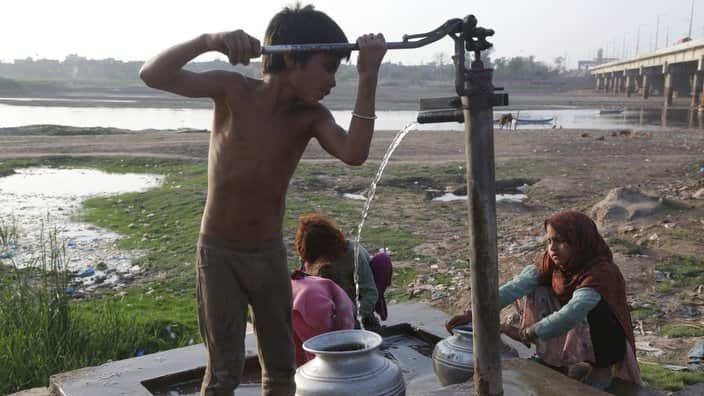 Boy taking out water