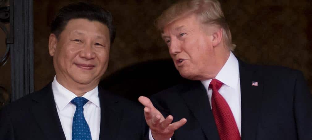 Chinese President Xi Jinping waves to the press as he walks with US President Donald Trump April 7, 2017.