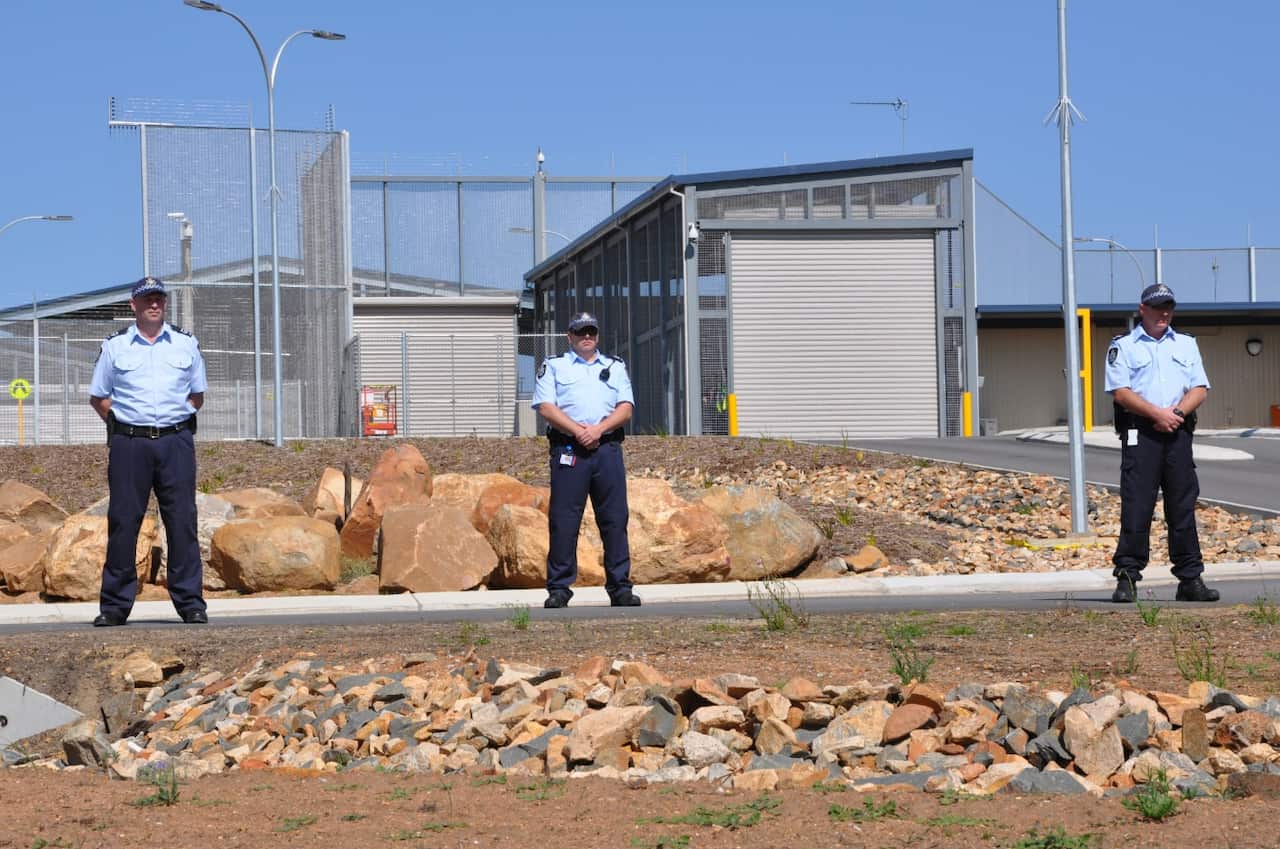 Federal police outside Yongah Hill Immigration Detention Centre where activists called for an end to mandatory imprisonment. Aug 26.