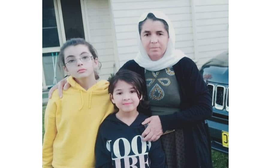 Zahreh with her two young daughter