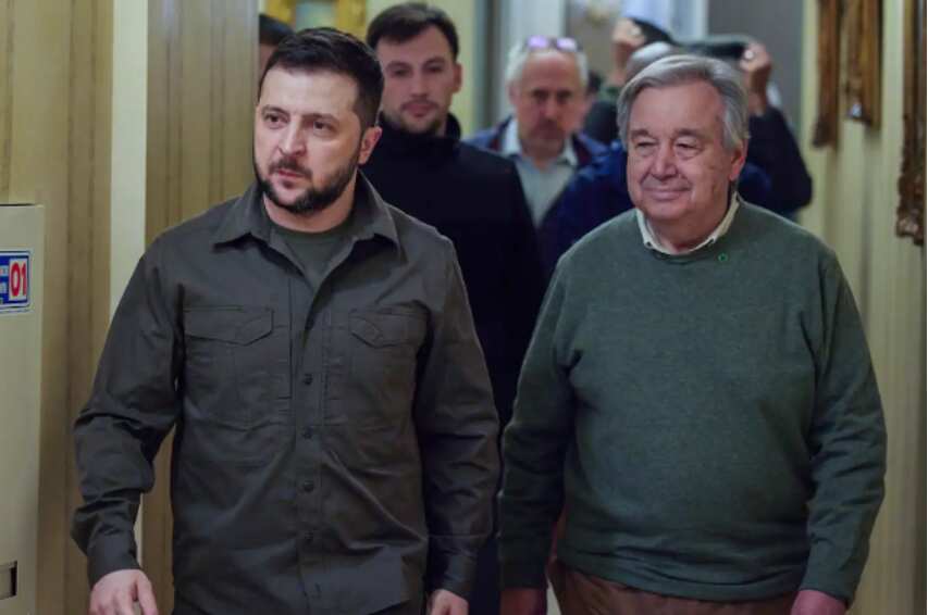 Ukrainian President Volodymyr Zelenskyy (left) and UN Secretary-General Antonio Guterres walk in the hall during their meeting in Kyiv, Ukraine, on Thursday.