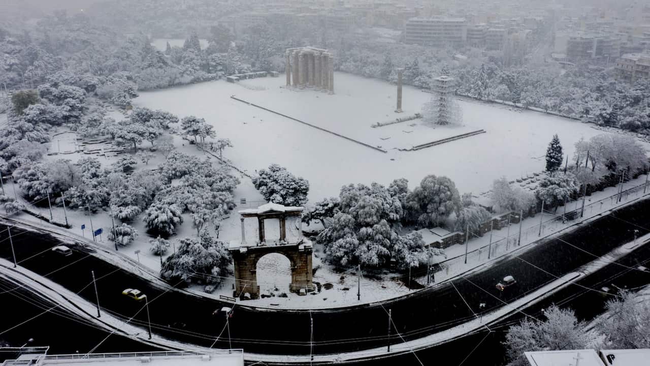 Snow covers the ancient temple of Zeus in Athens