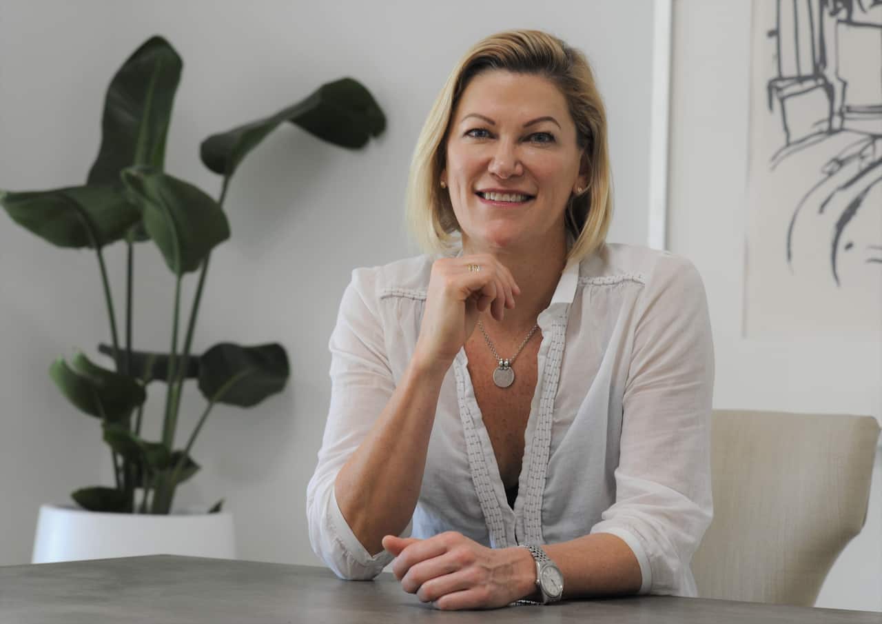 Amanda Price head of high growth ventures at KPMG, sitting at a desk.