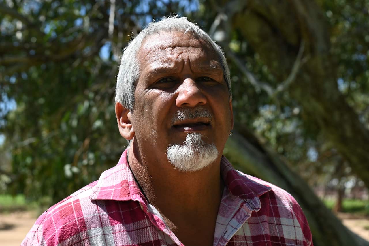 A man stands for a photo. 