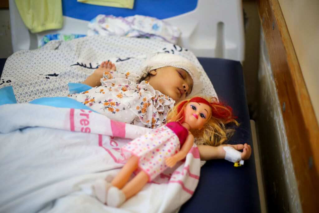 An injured Palestinian child is seen in an intensive care unit at Nasser Hospital, Gaza.