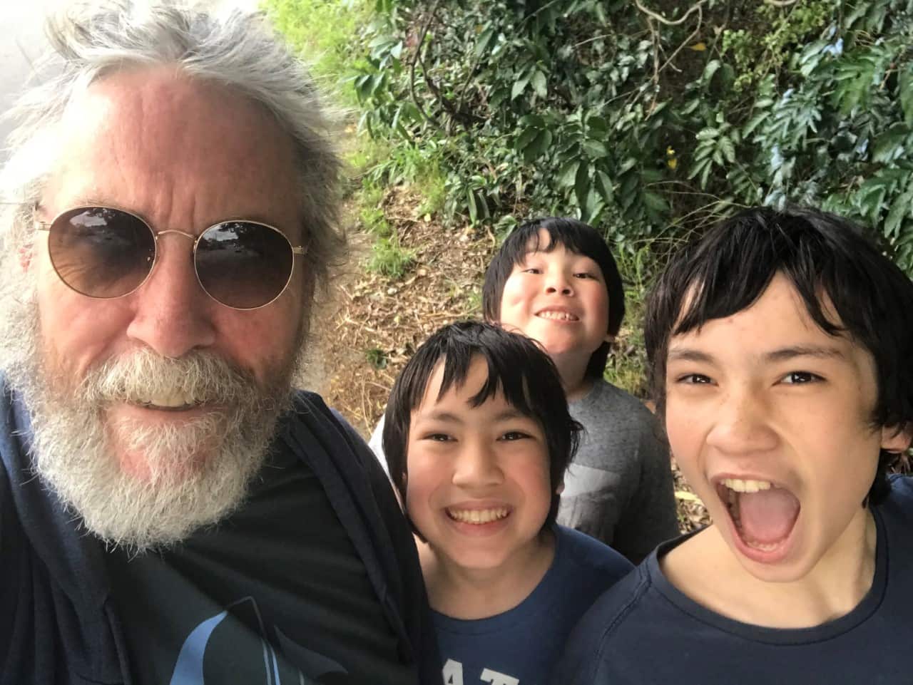 Simon Harvey pictured with his three sons.