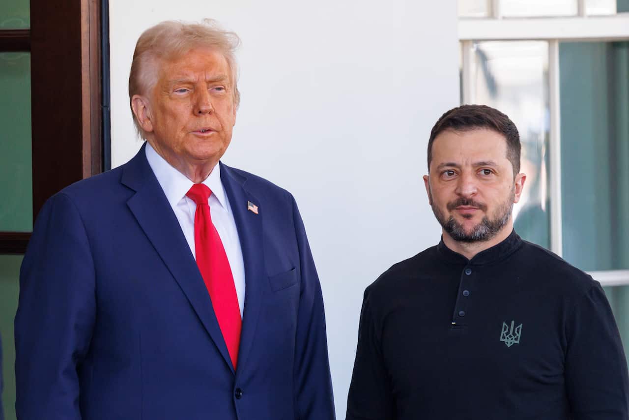 Donald Trump and Volodymyr Zelenskyy standing next to each other.