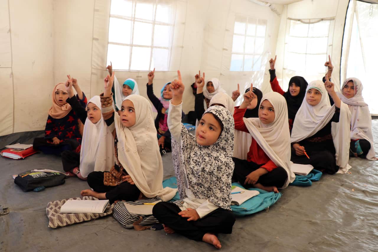 Afghan school girls attend class in Kandahar, Afghanistan.