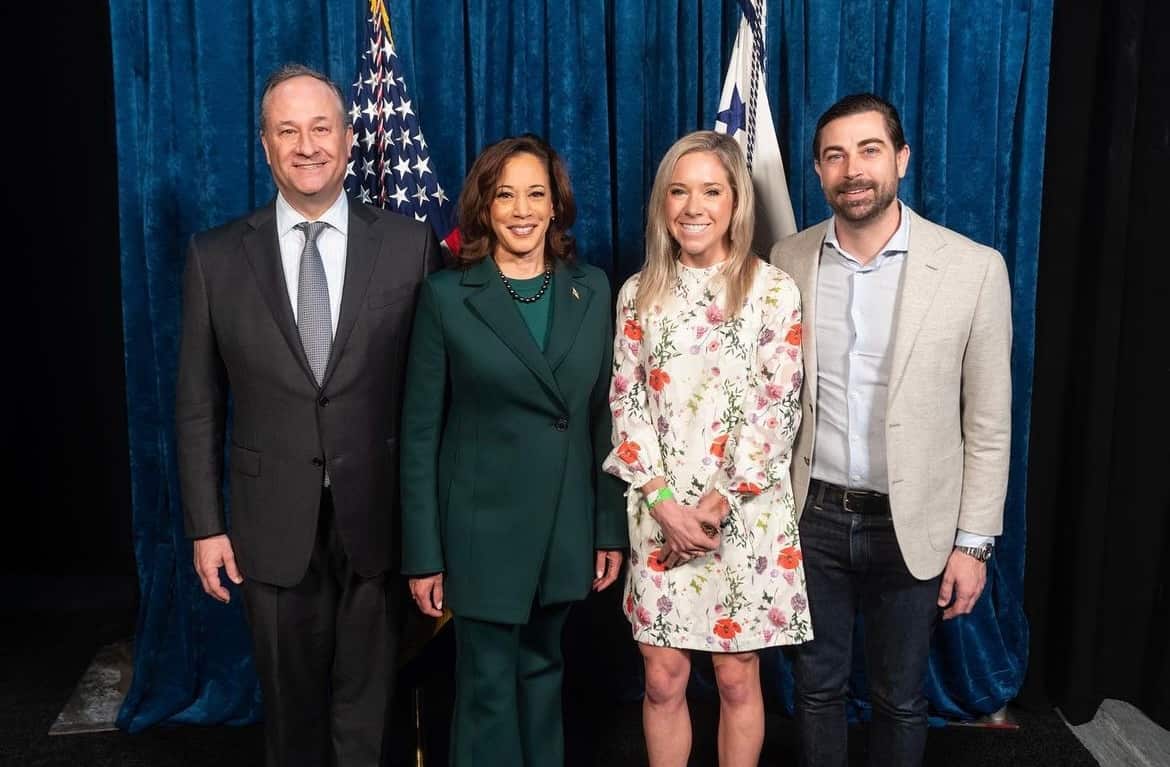 Four people smiling at the camera.