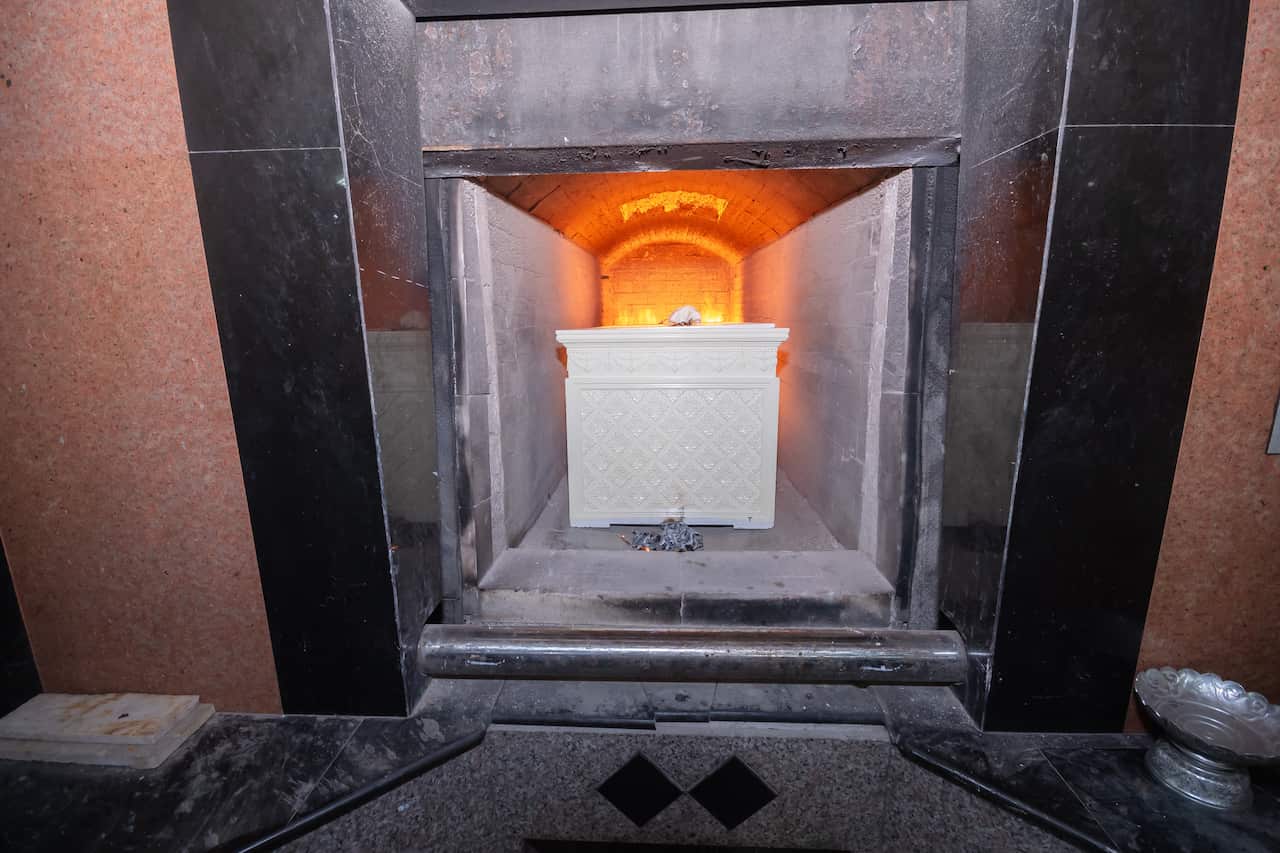 A coffin in a furnace at a crematorium.