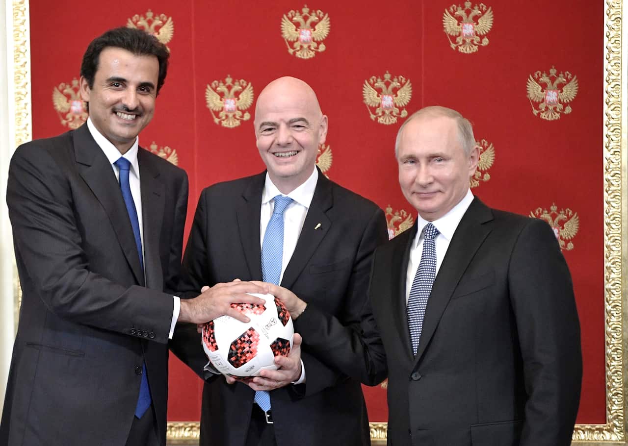 FIFA President Gianni Infantino, center, with Russian President Vladimir Putin, right,  and the Emir of Qatar Sheikh Tamim bin Hamad al-Thani in 2018.