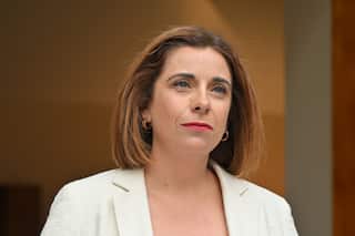 A woman in a white jacket
