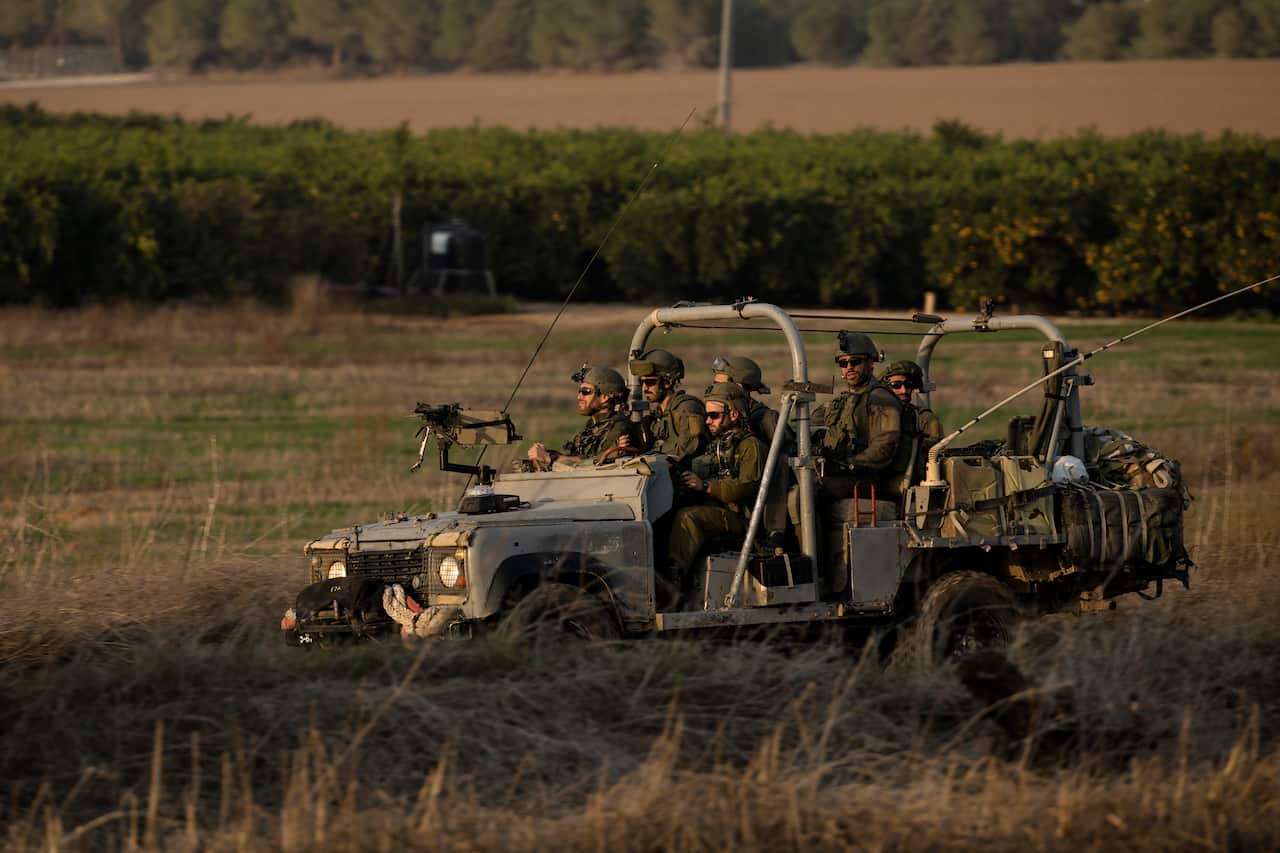 Israeli soliders in an army vehicle