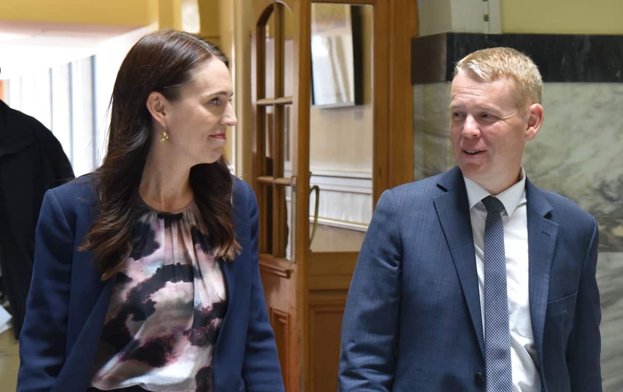 Outgoing NZ PM Jacinda Ardern and incoming leader Chris Hipkins at Parliament House in Wellington on Sunday 22 January.