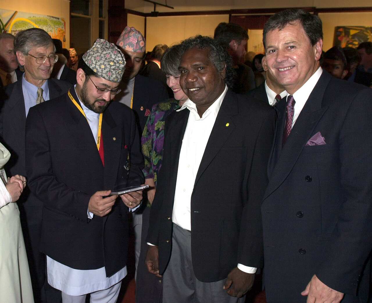 Dipendra Shah with Mandawuy Yunupingu and Ray Martin at a function on September 29, 2000, in Sydney, Australia. (Photo by Peter Carrette Archive/Getty Images)