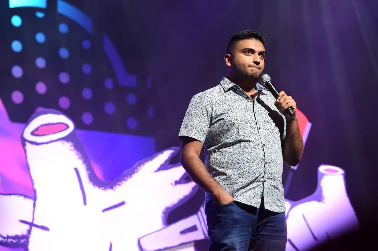 Comedian Suraj Kolarkar on stage at RAW Comedy Festival 2019.JPG