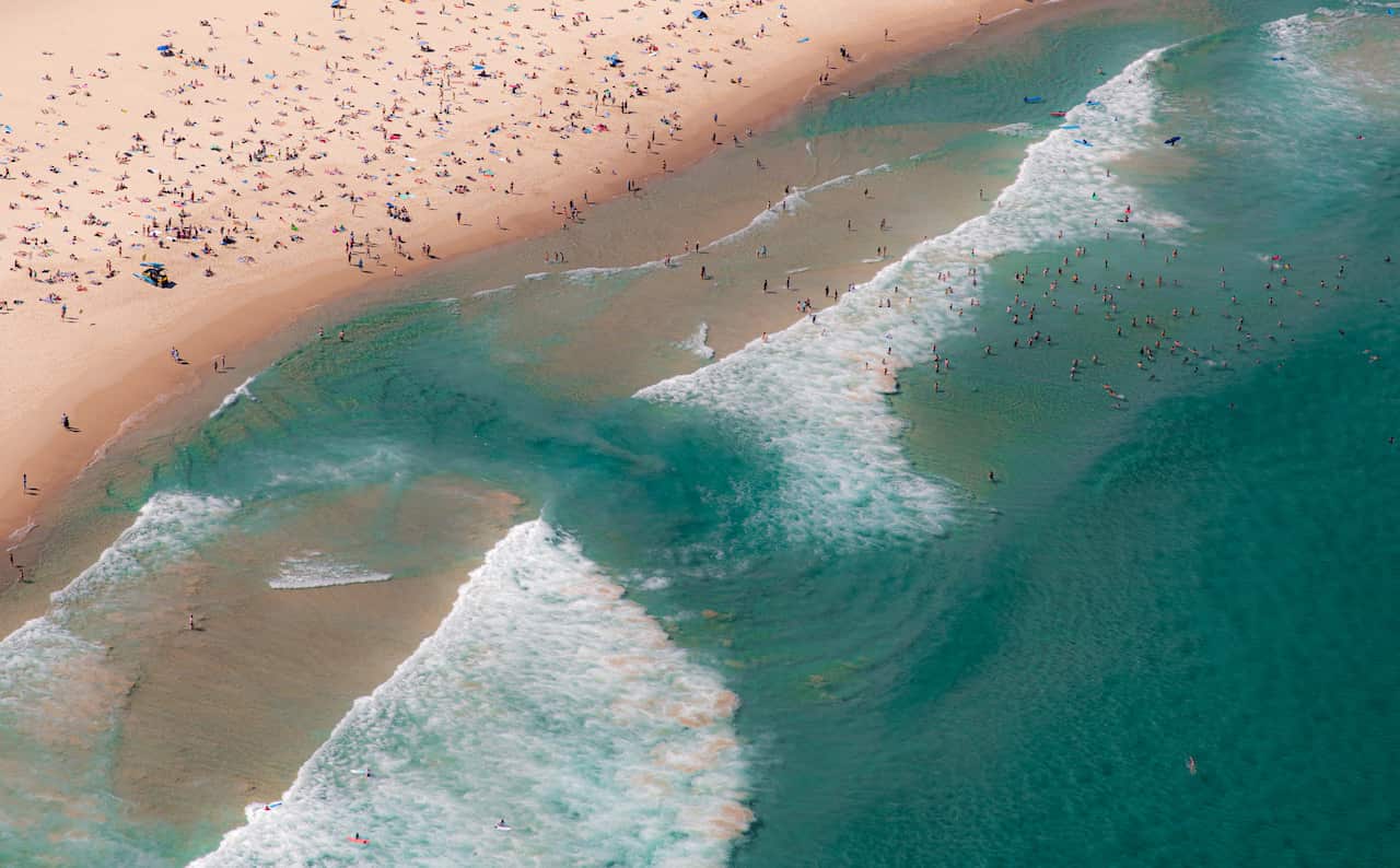 Bondi Beach water swirling rip current looking down helicopter view