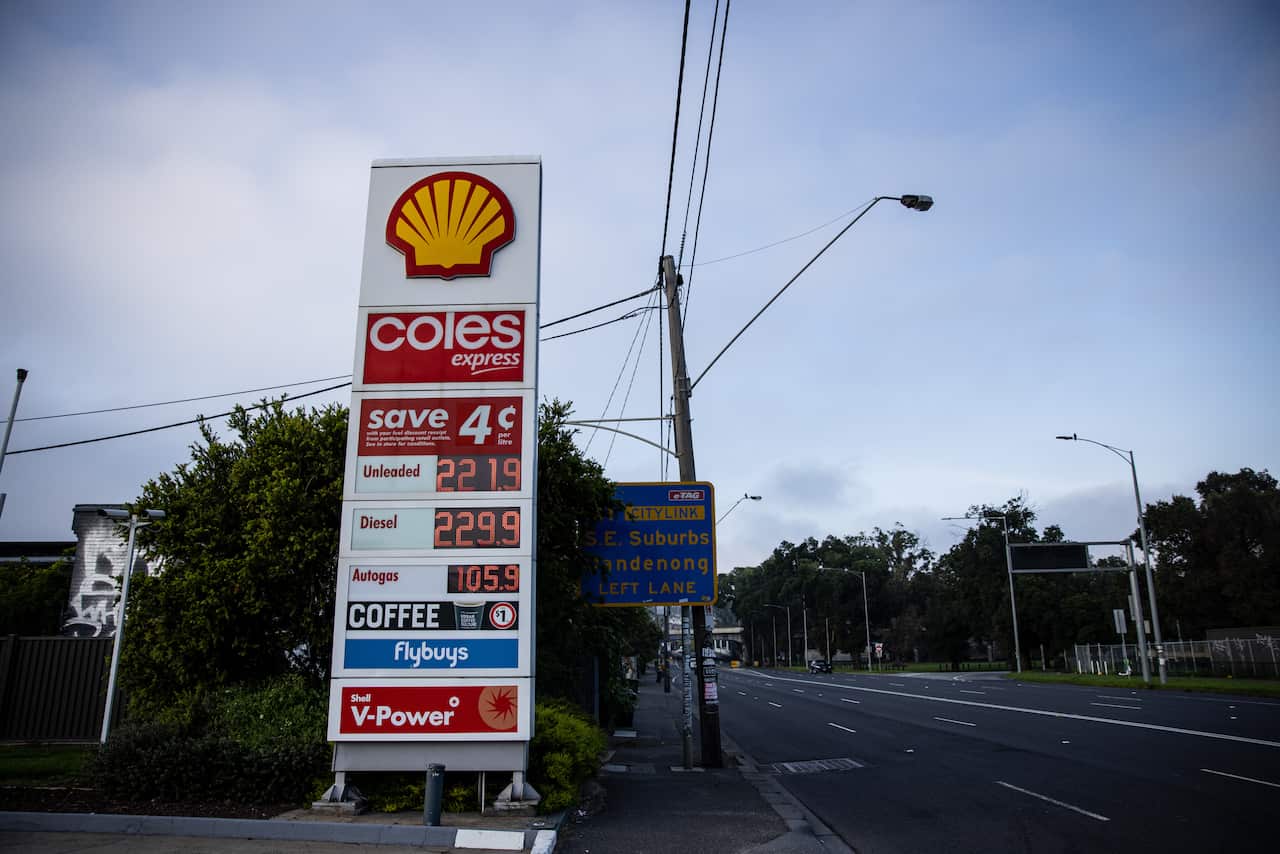 Fuel prices are listed on a board at a service station in Melbourne showing unleaded petrol as 221.9c per litre.