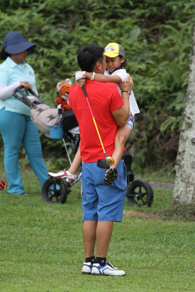 Amateur golfer Jeneath Wong as a child on the green with her father Kenneth. 