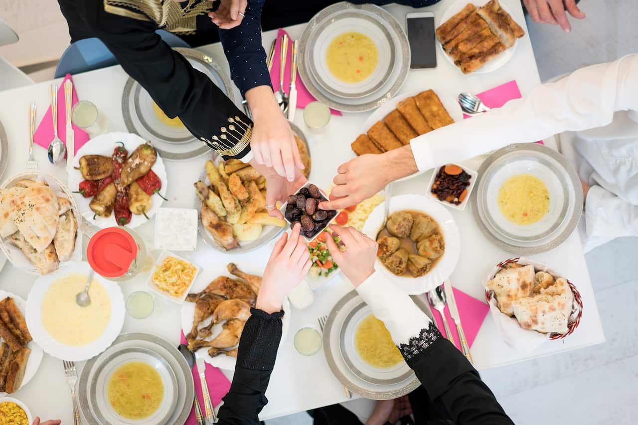 Friends gathering for eating dinner together