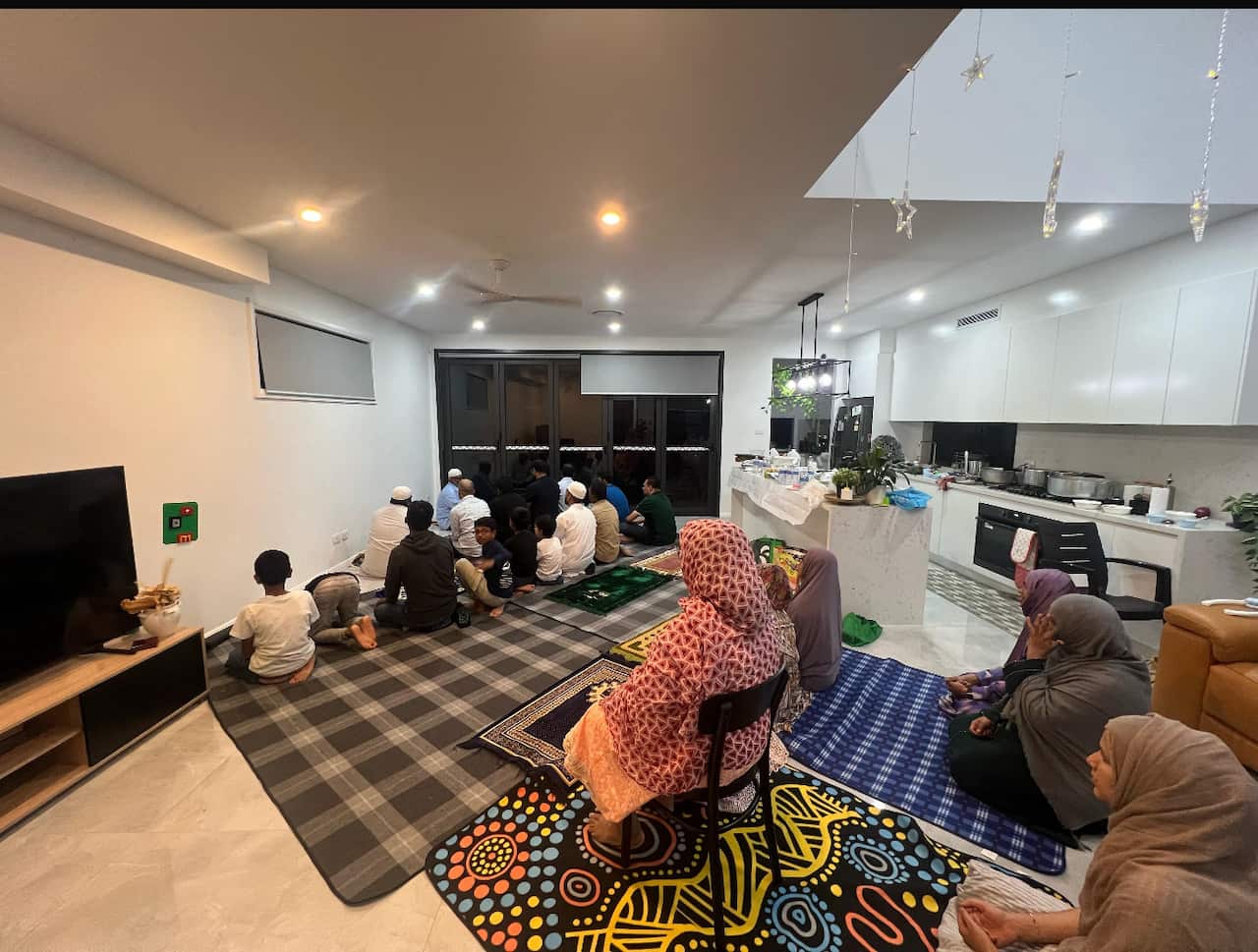 Family & friends praying during Ramadan in Brisbane