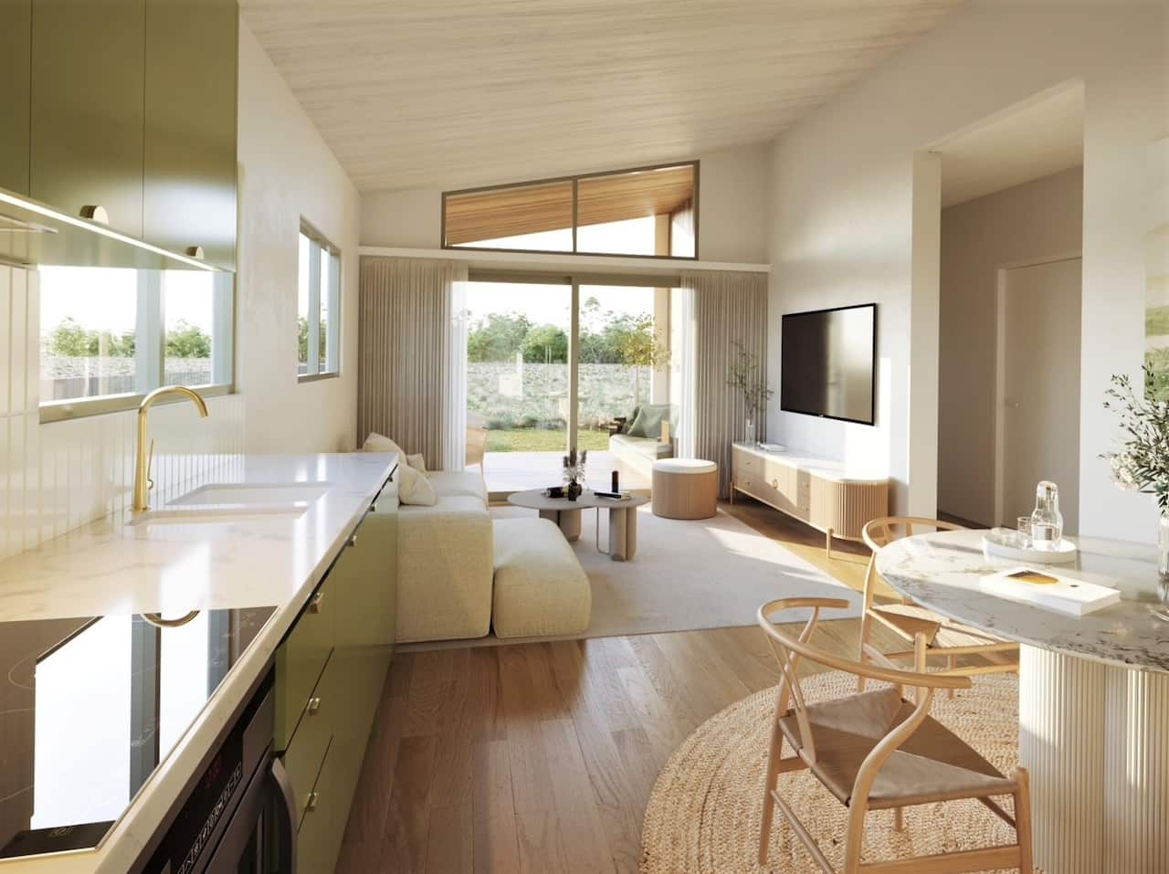A tiny house interior with timber detail and large glass entry door and windows.