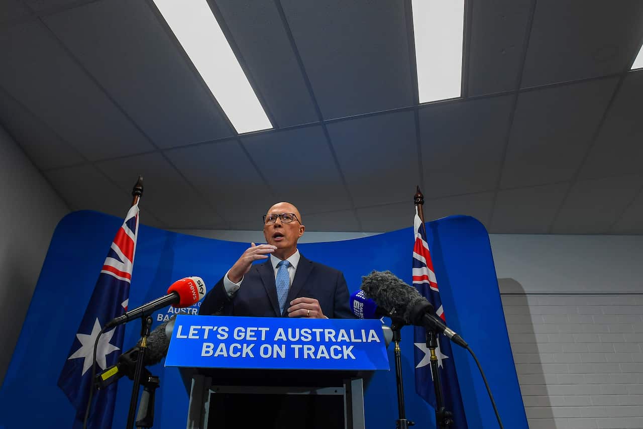 Peter Dutton speaks at a lectern.